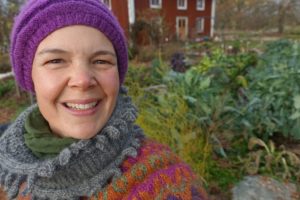 Sara Backmo stands in her kitchen garden